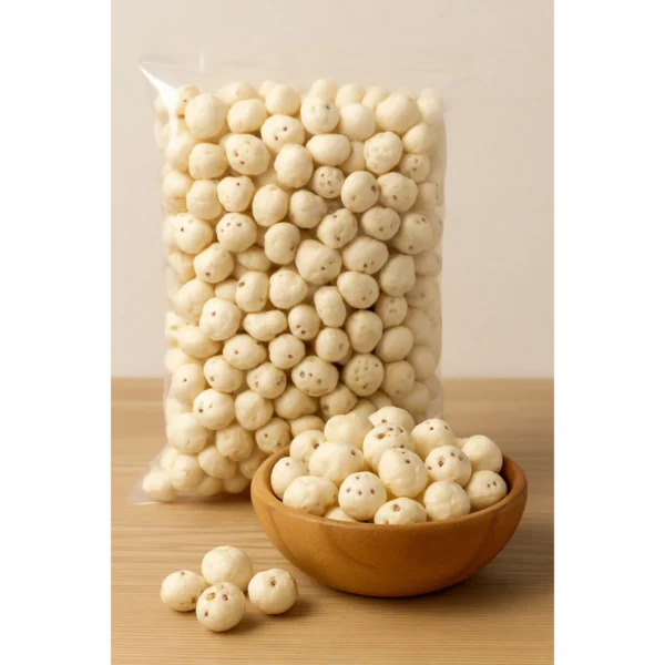A wooden bowl filled with 5 Soota Raw Makhana, with a plastic bag of additional puffed lotus seeds in the background, highlighting premium quality and bulk packaging.