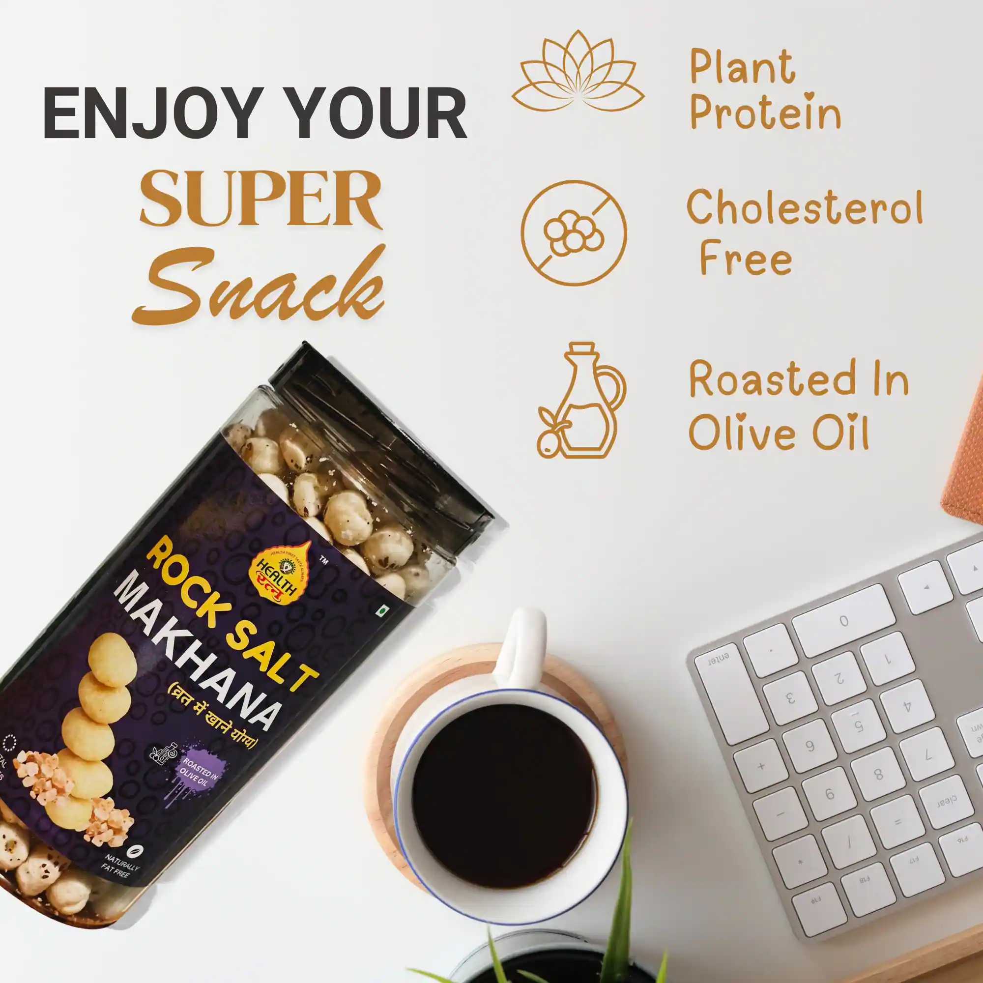 Health Ratna Rock Salt Makhana jar on a white desk next to a coffee cup and keyboard for healthy office snacking.